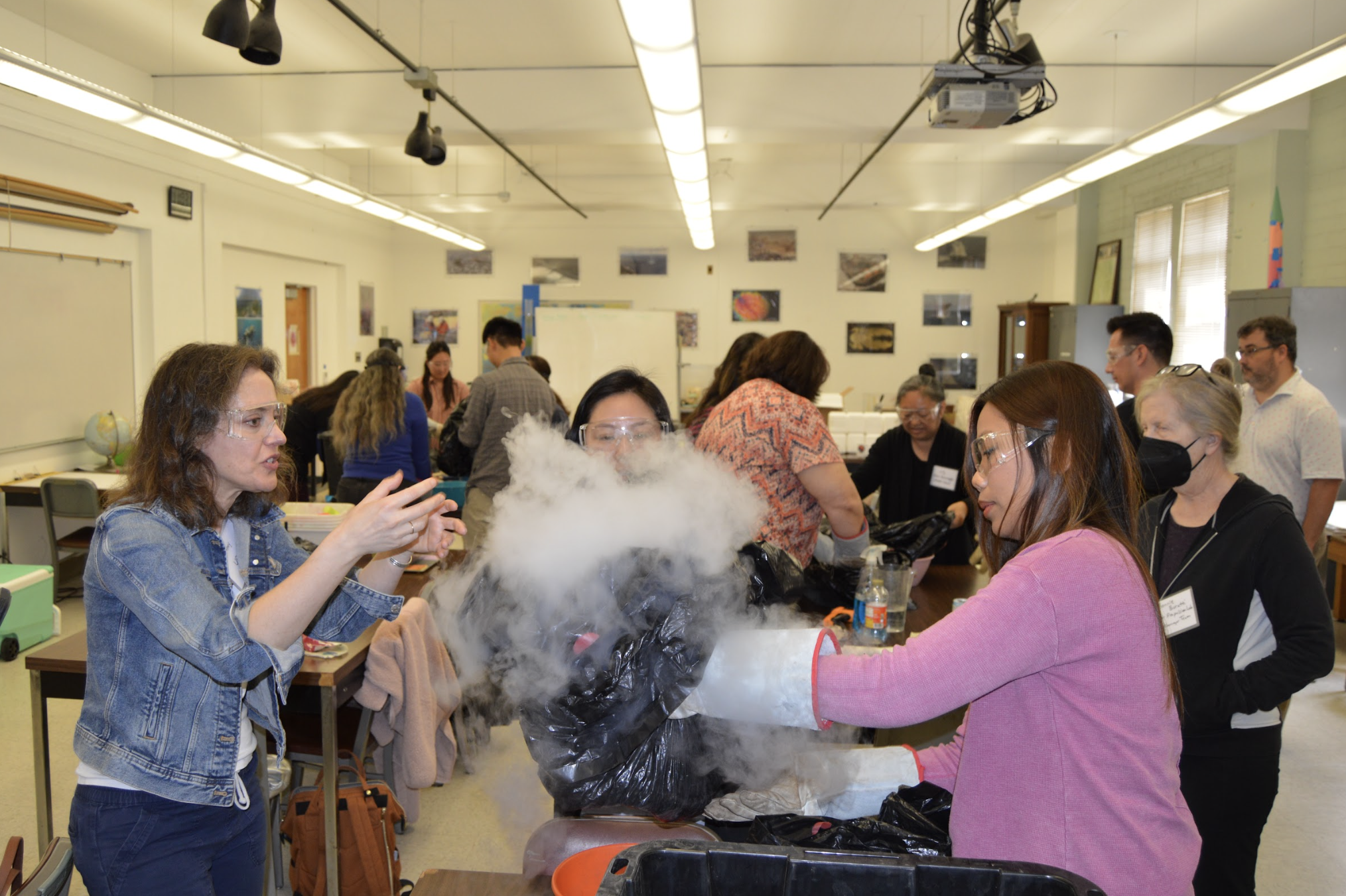 P.I. Amy Mainzer demonstrating how to mix materials inside a black bag to ddv